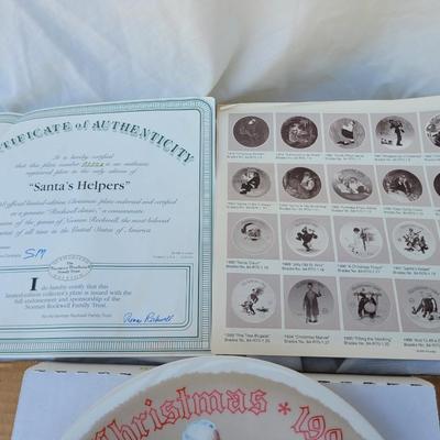 Sale Photo Thumbnail #230: Manufacturer: Knowles China.
Year: 1998.
Title: "Santa's Helpers".
Collectibility: It is a limited edition collector's plate and often comes with a certificate of authenticity, as seen in the imag
