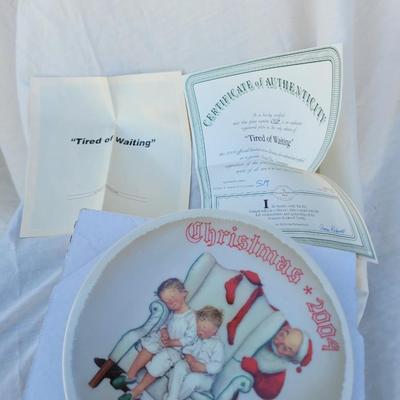 Sale Photo Thumbnail #239: Artist & Manufacturer: It features a classic Norman Rockwell illustration and was produced by Knowles China, sold by The Bradford Exchange as part of their annual Christmas plate series.
Title and Year: The plate is titled "Tired of Waiting" and specifica