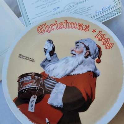 Sale Photo Thumbnail #241: The plate depicts Santa Claus with a drum and a note that reads "Please give me a drum, Tommy," reflecting the spirit of Christmas giving. 
It is a vintage collector's item, manufactured in the 1990s, and is often sought after by collectors of Norman Rock