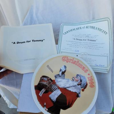 Sale Photo Thumbnail #242: The plate depicts Santa Claus with a drum and a note that reads "Please give me a drum, Tommy," reflecting the spirit of Christmas giving. 
It is a vintage collector's item, manufactured in the 1990s, and is often sought after by collectors of Norman Rock