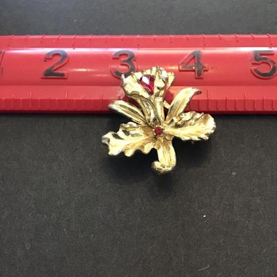 Vintage Coro Gold tone with red rhinestones brooch