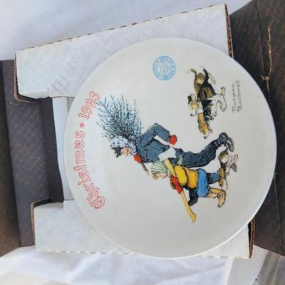 Sale Photo Thumbnail #245: It is the 20th plate in an annual series of Christmas plates by Norman Rockwell. 
It is a hand-numbered, limited edition plate certified by the Rockwell Society of America and produced by Knowles China.