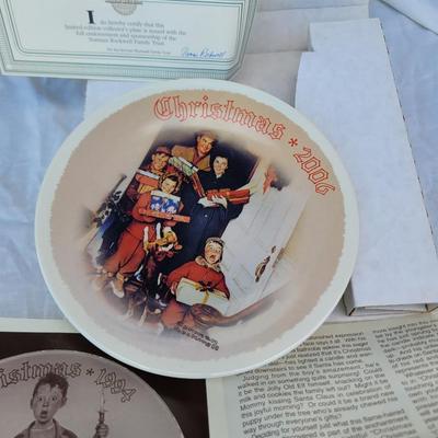 Sale Photo Thumbnail #326: Also known as the Norman Rockwell Christmas 2006 plate. 
It is the tenth issue in the Rockwell Heritage Collection, a limited-edition series endorsed by the Rockwell Society of America. 
The plate features a scene depicting a family gathered around a door