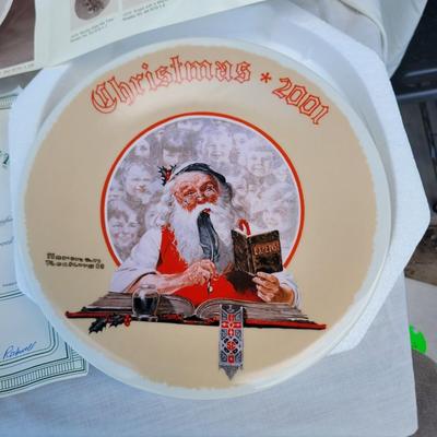 Sale Photo Thumbnail #330: "Bookkeeper Santa". 
It is a vintage Christmas-themed plate made of fine china by Knowles. 
The design depicts Santa Claus as a bookkeeper, surrounded by children's faces. 
It is an 8-inch diameter plate and comes with a Certificate of Authenticity but no