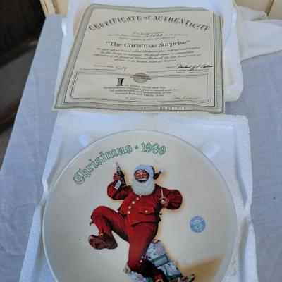 Sale Photo Thumbnail #340: vintage Norman Rockwell Christmas collector's plate from 1989, specifically featuring a depiction of Santa Claus, likely part of a series like "Jolly Old St. Nick" or a similar Christmas theme. 
Artist and Series:
The plate features artwork by renowned Am