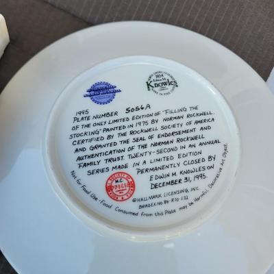 Sale Photo Thumbnail #344: Norman Rockwell "Filling The Stocking" collector plate from the 1995 Christmas series by Knowles. 
It is a limited edition plate, originally painted by Norman Rockwell in 1975, and certified by the Rockwell Society of America. 
The plate is part of an ann