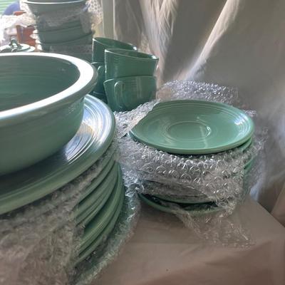 Sale Photo Thumbnail #455: Complete Fiestaware Set, 49 pieces total. 8 place settings including dinner plate, side plate, bowl, cup, and saucer for each. Also includes salt and pepper shakers, trivet, gravy boat, 2 condiment containers, and spoon rest. All in good condition.