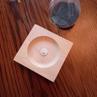 HOURGLASS WITH MAGNETIC BASE AND A FLOATING HOURGLASS