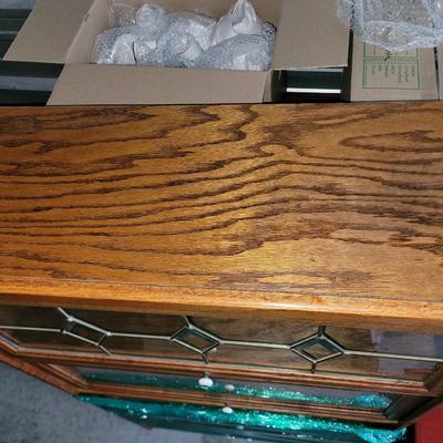 Sale Photo Thumbnail #472: Hutch is partially wrapped and will be fully wrapped again for protection. It seems not to have a mark on it, only the top cabinet has the leaded glass, but all lift up and slide back.
60" tall,  30" wide and 12.5" deep, beautiful piece.