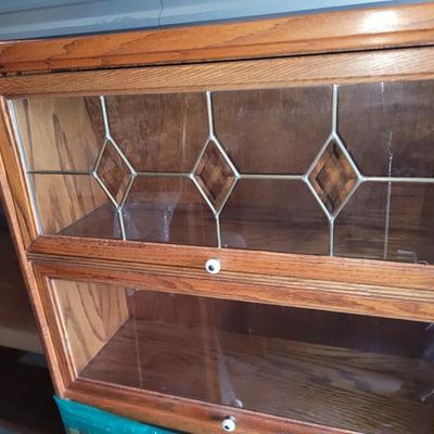 Sale Photo Thumbnail #471: Hutch is partially wrapped and will be fully wrapped again for protection. It seems not to have a mark on it, only the top cabinet has the leaded glass, but all lift up and slide back.
60" tall,  30" wide and 12.5" deep, beautiful piece.