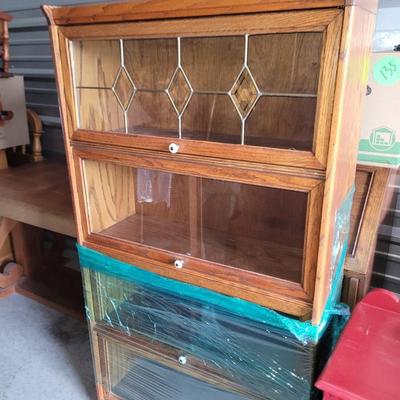Sale Photo Thumbnail #470: Hutch is partially wrapped and will be fully wrapped again for protection. It seems not to have a mark on it, only the top cabinet has the leaded glass, but all lift up and slide back.
60" tall,  30" wide and 12.5" deep, beautiful piece.