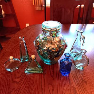 A COLLECTION OF GLASS BOTTLES AND LARGE JAR MADE IN ITALY