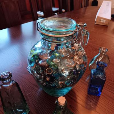 A COLLECTION OF GLASS BOTTLES AND LARGE JAR MADE IN ITALY
