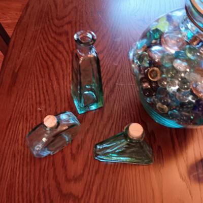 A COLLECTION OF GLASS BOTTLES AND LARGE JAR MADE IN ITALY
