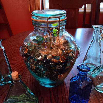 A COLLECTION OF GLASS BOTTLES AND LARGE JAR MADE IN ITALY