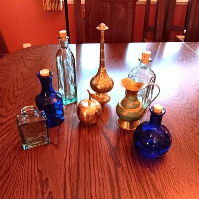 GLASS BOTTLES AND BRASS DECOR