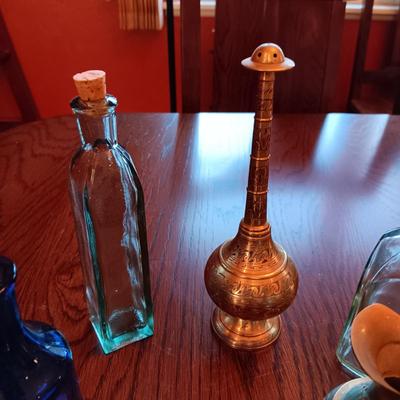 GLASS BOTTLES AND BRASS DECOR