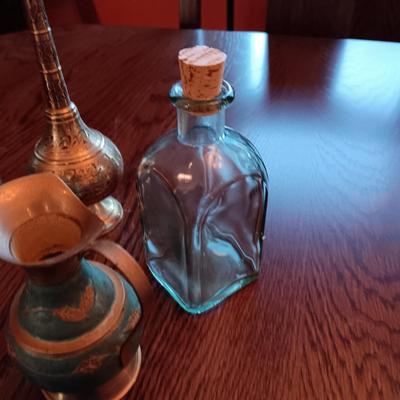 GLASS BOTTLES AND BRASS DECOR