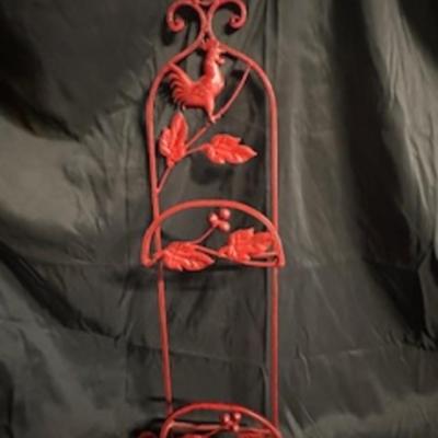 A ROOSTER AND A METAL WALL HUNG PLATE HOLDER