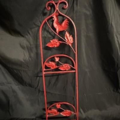 A ROOSTER AND A METAL WALL HUNG PLATE HOLDER