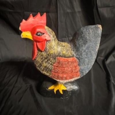 A ROOSTER AND A METAL WALL HUNG PLATE HOLDER