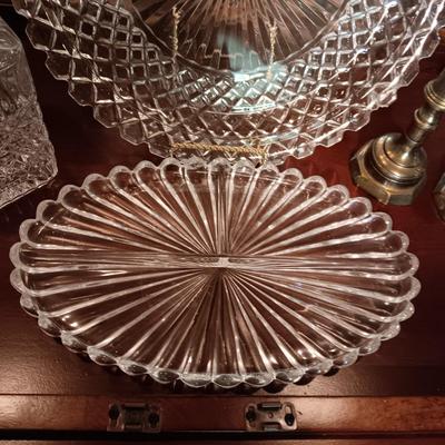 CRYSTAL AND GLASS SERVING PIECES PLUS BRASS CANDLESTICKS