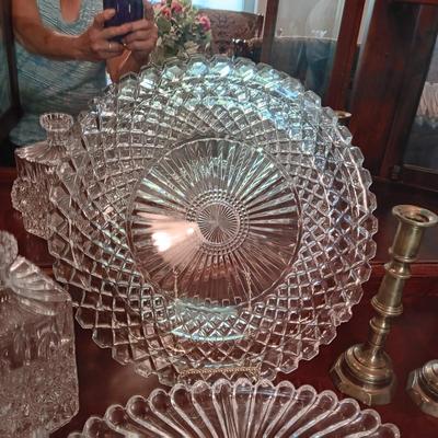 CRYSTAL AND GLASS SERVING PIECES PLUS BRASS CANDLESTICKS