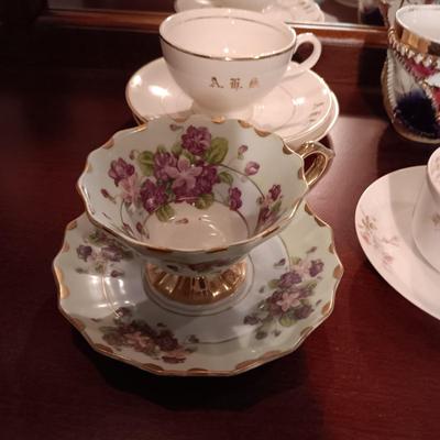 SHIRLEY TEMPLE AND MUSTACHE CUPS PLUS TEACUPS AND SAUCERS