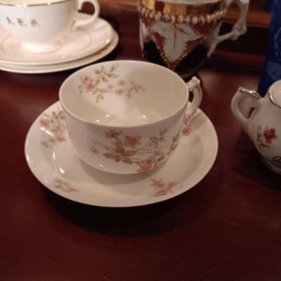 SHIRLEY TEMPLE AND MUSTACHE CUPS PLUS TEACUPS AND SAUCERS