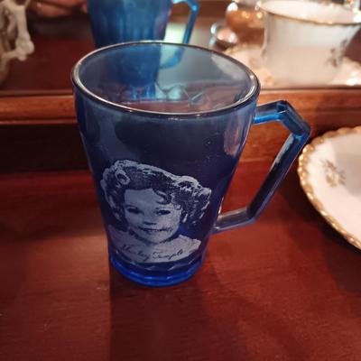 SHIRLEY TEMPLE AND MUSTACHE CUPS PLUS TEACUPS AND SAUCERS