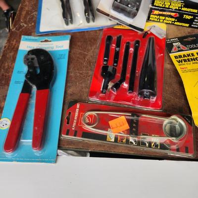 Box lot of New Tools in original package Dowrling Kit, Battery testers , Arrow T50 Stapler Black And Decker Drill Bits Hex Crimping tool