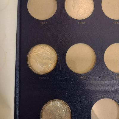 U. S. Mint Peace Silver Dollar Collection Booklet with Various Date Circulated Coins as Shown (#17)