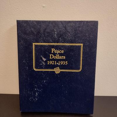 U. S. Mint Peace Silver Dollar Collection Booklet with Various Date Circulated Coins as Shown (#17)