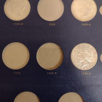 U. S. Mint Peace Silver Dollar Collection Booklet with Various Date Circulated Coins as Shown (#17)