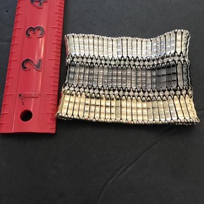 Beautiful, silver, gunmetal and gold, toned stretchy bracelet with rhinestones