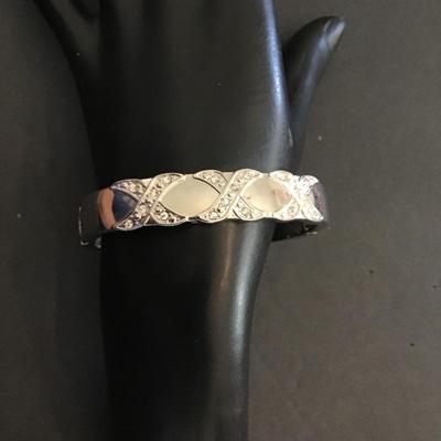 Very nice silver tone, hinged cuff bracelet