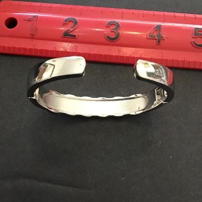 Very nice silver tone, hinged cuff bracelet