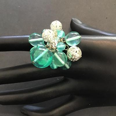 Very nice silver toned stretchy ring with plastic and silver beads