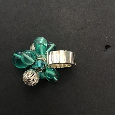 Very nice silver toned stretchy ring with plastic and silver beads