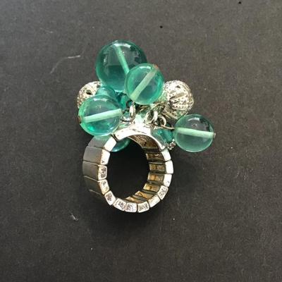 Very nice silver toned stretchy ring with plastic and silver beads