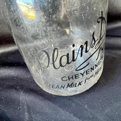 Sale Photo Thumbnail #633: This is a RARE bottle!!  Plains Dairy predominantly used square bottles!  The round ones are very hard to find.