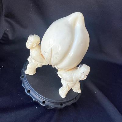 Sale Photo Thumbnail #796: 3 men carrying a peach.  Don't know if it is ivory, but there have been some repairs...please look at the photos.