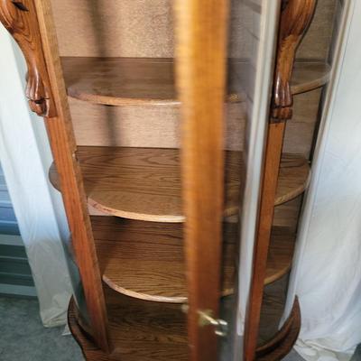 Sale Photo Thumbnail #620: Measures 58" tall, 36" at its widest and 17" deep.
Rounded glass front, unwrapped for photos but will be rewrapped for buyers transport. Not a blemish that I could see