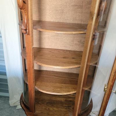 Sale Photo Thumbnail #619: Measures 58" tall, 36" at its widest and 17" deep.
Rounded glass front, unwrapped for photos but will be rewrapped for buyers transport. Not a blemish that I could see