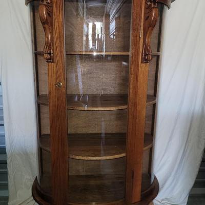 Sale Photo Thumbnail #609: Measures 58" tall, 36" at its widest and 17" deep.
Rounded glass front, unwrapped for photos but will be rewrapped for buyers transport. Not a blemish that I could see