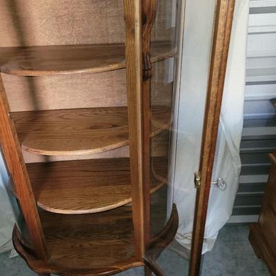 Sale Photo Thumbnail #621: Measures 58" tall, 36" at its widest and 17" deep.
Rounded glass front, unwrapped for photos but will be rewrapped for buyers transport. Not a blemish that I could see