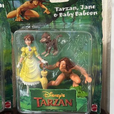 Ronald McDonald toy and Disney Tarzan’s.