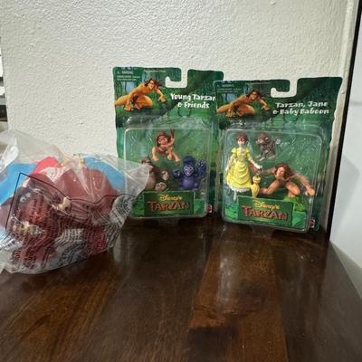 Ronald McDonald toy and Disney Tarzan’s.