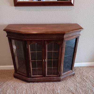 LIGHTED FOYER DISPLAY CABINET WITH WOOD FRAMED BEVELED WALL MIRROR