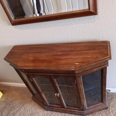LIGHTED FOYER DISPLAY CABINET WITH WOOD FRAMED BEVELED WALL MIRROR